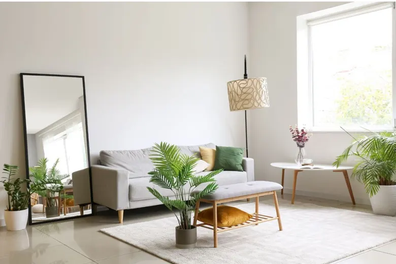 A minimalist living room design with a large mirror A minimalist living room design with a large mirror