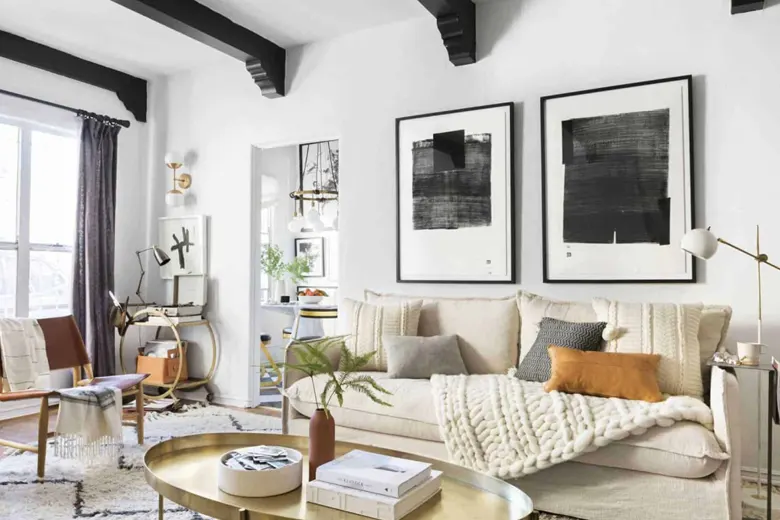 Pastel-coloured sofa with throw pillows in a living room Pastel-coloured sofa with throw pillows in a living room