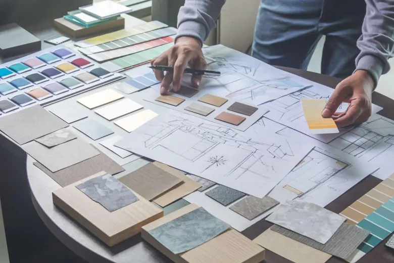A professional residential interior designer making sketches and selecting colours
A professional residential interior designer making sketches and selecting colours
