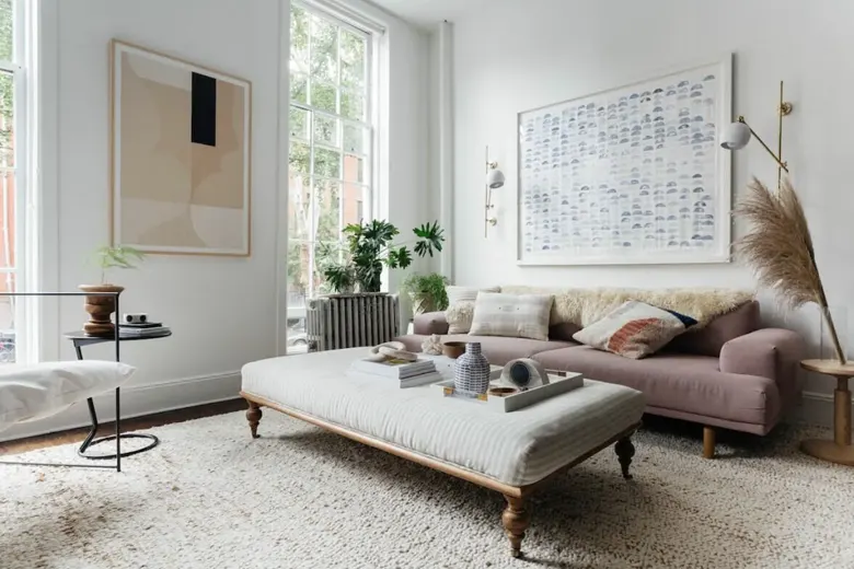 A carpeted seating area with bohemian interior features