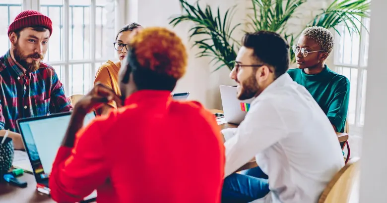 Group of UX designers discussing key findings from their user research