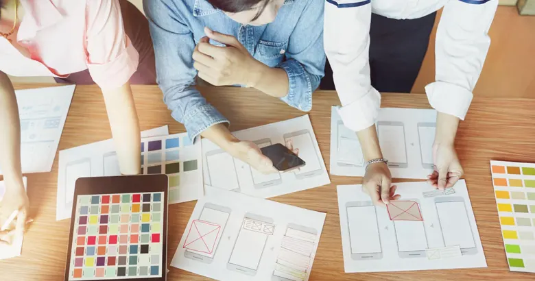 Alt Text: UX researchers using card sorting method to implement user inputs