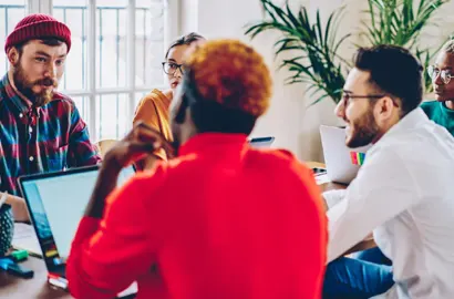 Group of UX designers discussing key findings from their user research