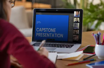 An AND learner presenting her Capstone project online in front of peers, mentors and a design jury