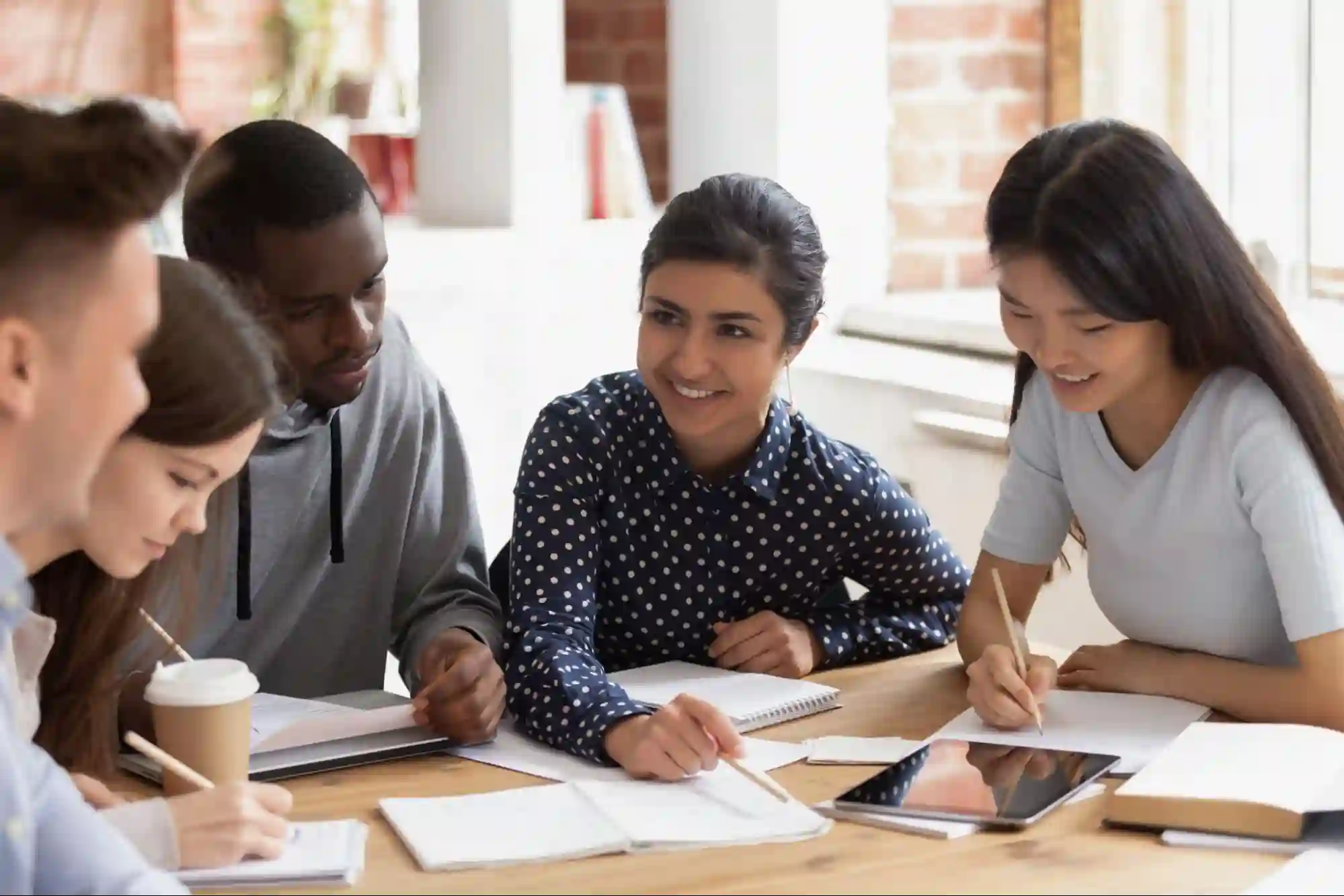 Group of students discussing study material