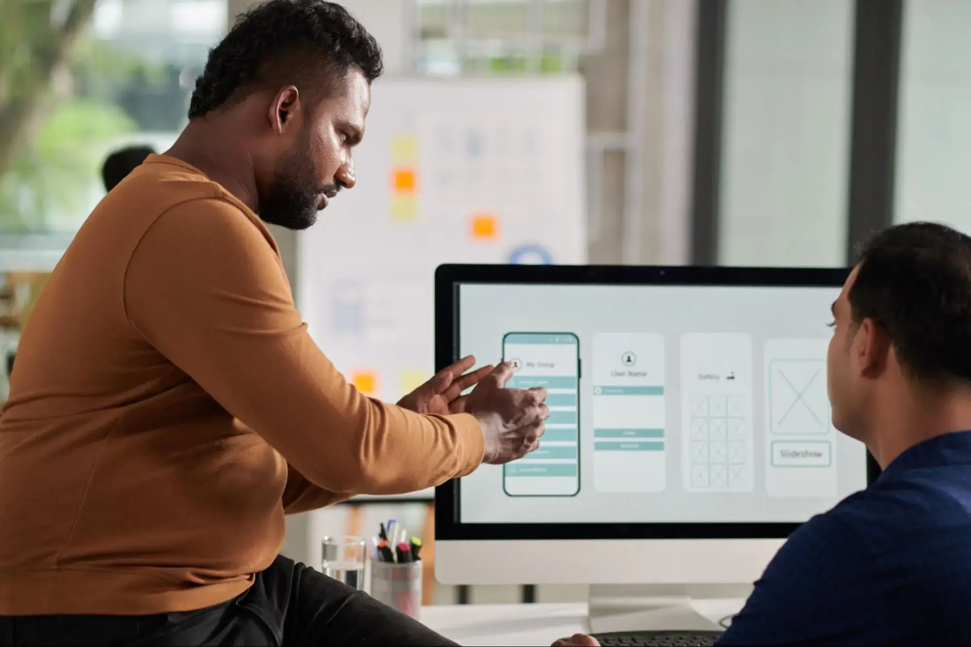UX Designers ideating on appropriate information architecture for a mobile application