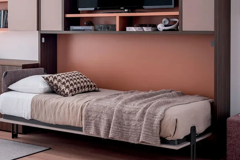 Small bedroom with a Murphy bed folded into the wall to maximize space.
Small bedroom with a Murphy bed folded into the wall to maximize space.