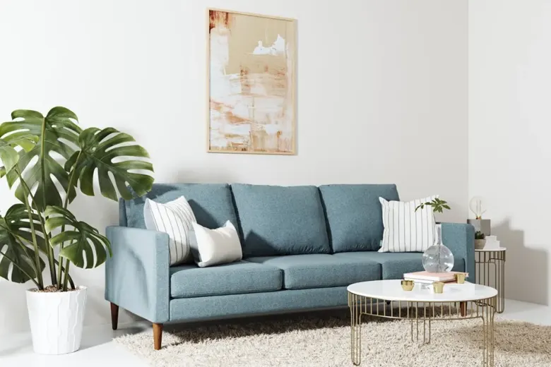 Reupholstered sofa in a modern fabric with matching decor. Reupholstered sofa in a modern fabric with matching decor.
