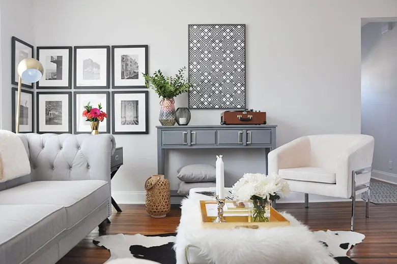 Gallery wall with mixed frames, black-and-white photos, and quotes.
Gallery wall with mixed frames, black-and-white photos, and quotes.