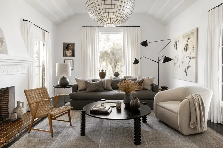 Living room with modern pendant lights and a striking chandelier.
Living room with modern pendant lights and a striking chandelier.