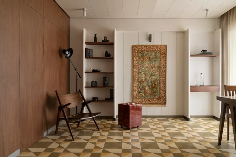 Room with artistic floor tiles and neutral walls.
Room with artistic floor tiles and neutral walls.