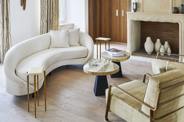 Living room with a curved sofa as a central design element. Living room with a curved sofa as a central design element.