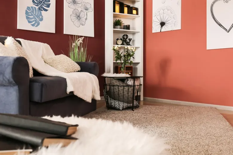 Reading nook with a comfortable chair, lamp, rug, and bookshelves near a window.
Reading nook with a comfortable chair, lamp, rug, and bookshelves near a window.