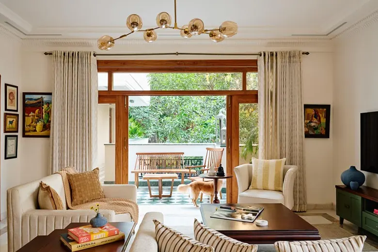 Room with full-length patterned curtains in bright colours.
Room with full-length patterned curtains in bright colours.