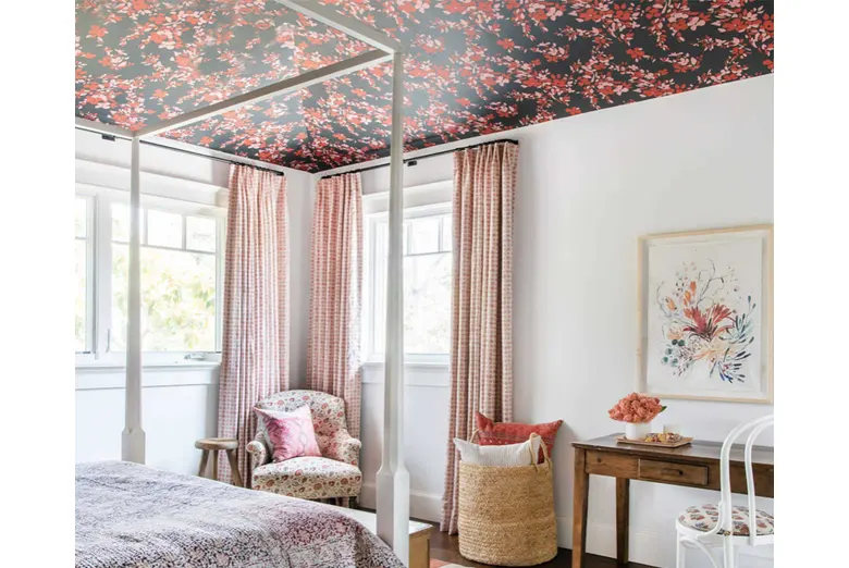 A master bedroom with a decorated ceiling.