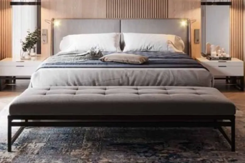Minimalist bedroom with clean lines, neutral colour palette, and refined, essential pieces of furniture.