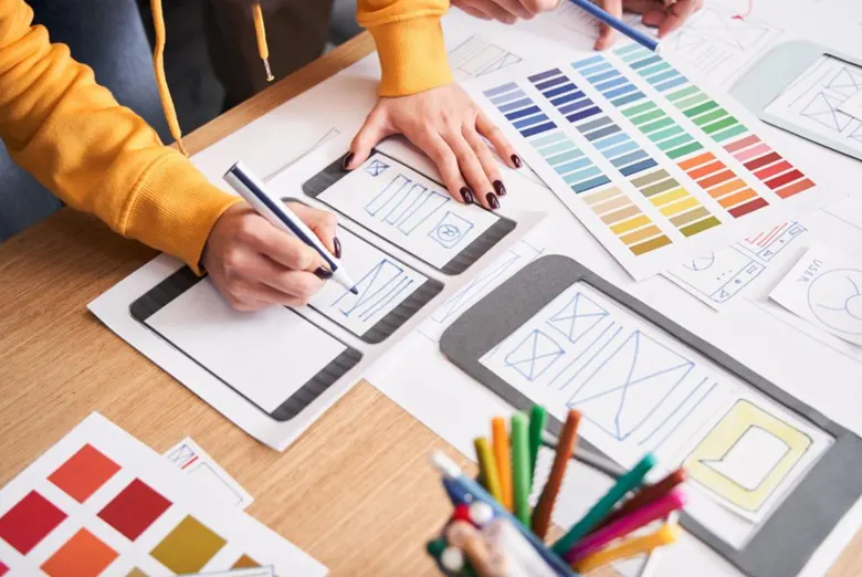Experience designer creating low-fidelity wireframes