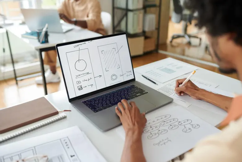 Designer creating low-fidelity wireframe of a mobile application
Designer creating low-fidelity wireframe of a mobile application