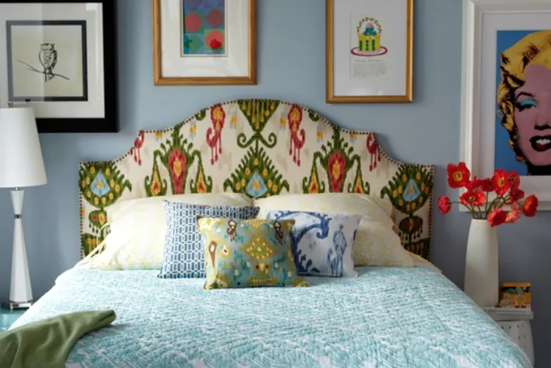 A retro-style bed with upholstered headboard.