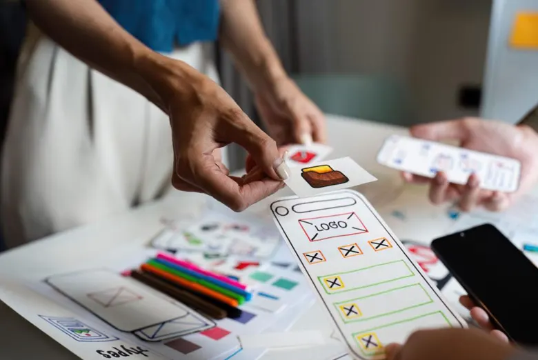 Interface designers deciding the app structure with card sorting