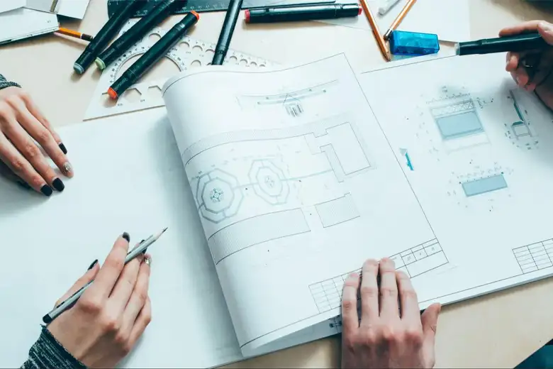 Corporate interior designers discussing the spatial layout for an office
Corporate interior designers discussing the spatial layout for an office