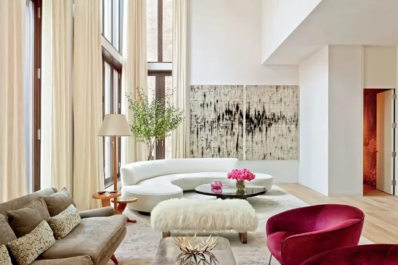 A spacious living room with wooden flooring and floor-to-ceiling windows
A spacious living room with wooden flooring and floor-to-ceiling windows