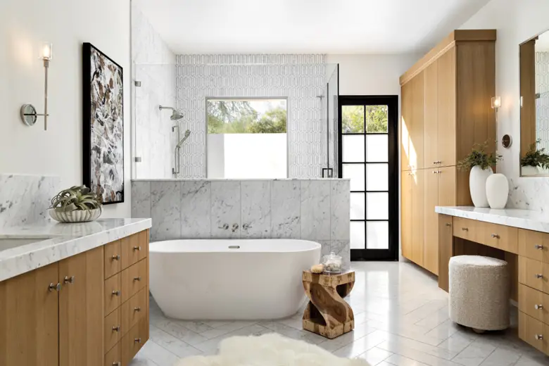 White marble bathroom with wooden cabinetry White marble bathroom with wooden cabinetry