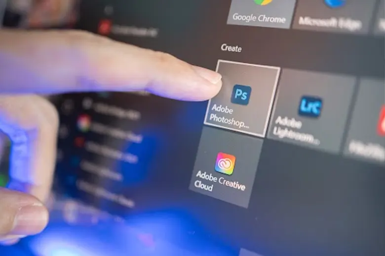 Adobe Photoshop, Lightroom, and Creative Cloud icons on a Windows 10 desktop, displayed alongside other Adobe apps like Illustrator.