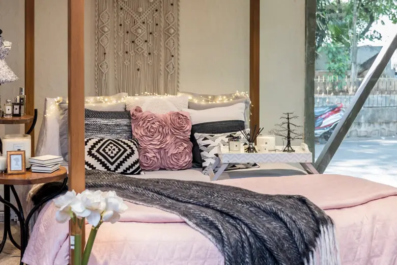 A cosy bedroom with a wooden top side table and a breakfast tray
A cosy bedroom with a wooden top side table and a breakfast tray