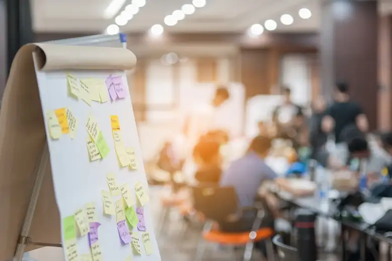 Sticky notes and a board illustrating why design thinking tools are important for UI/UX planning and problem-solving.
