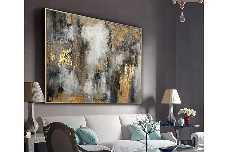 A big, statement painting hanging in a living room. A big, statement painting hanging in a living room.