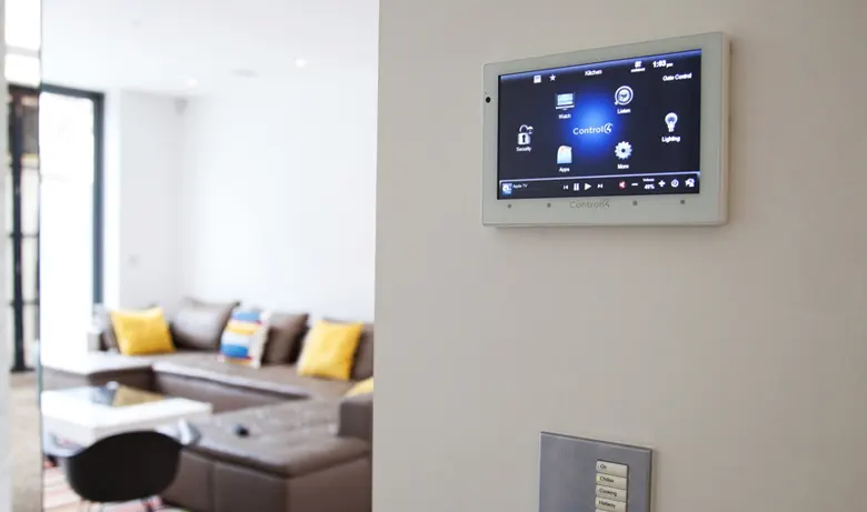 Living room with smart home technology screen on the wall. Living room with smart home technology screen on the wall.