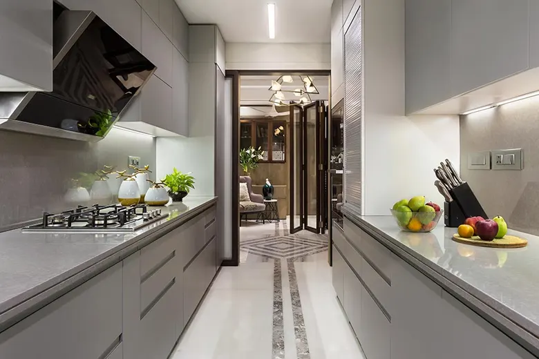 Indian parallel kitchen interior design idea with a monochrome scheme.
Indian parallel kitchen interior design idea with a monochrome scheme.