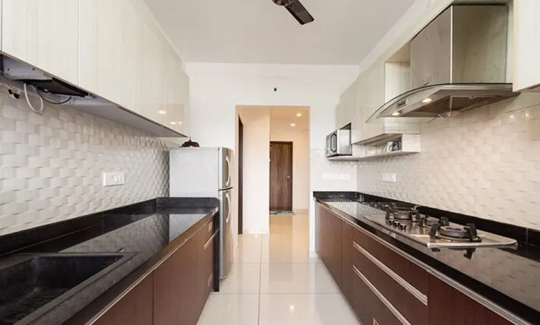 Indian parallel kitchen interior design idea with a chimney.
Indian parallel kitchen interior design idea with a chimney.