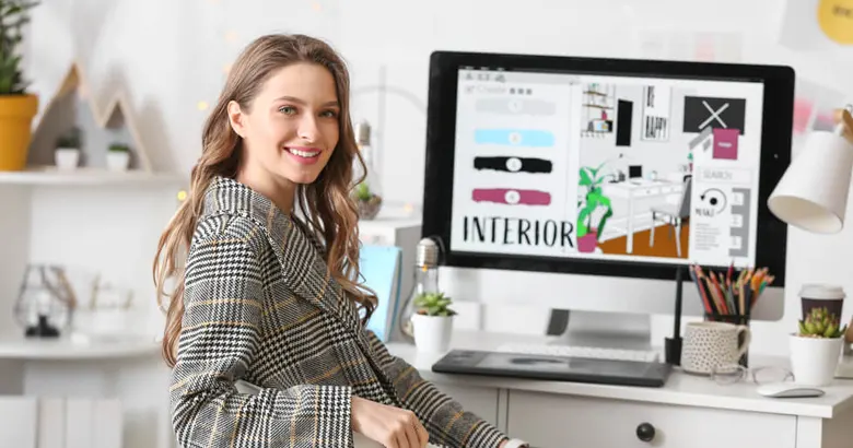 An interior designer working on her computer system.