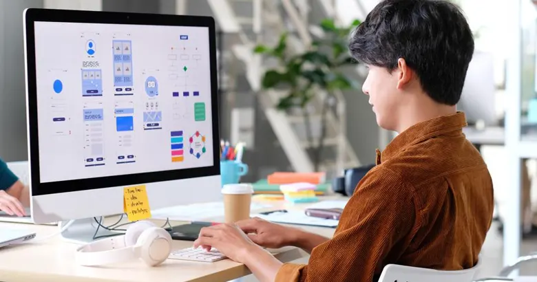 Student working on a project for a UI/UX design internship.