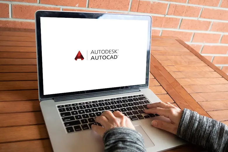Young professional working on a laptop using Autodesk software AutoCad.
Young professional working on a laptop using Autodesk software AutoCad.