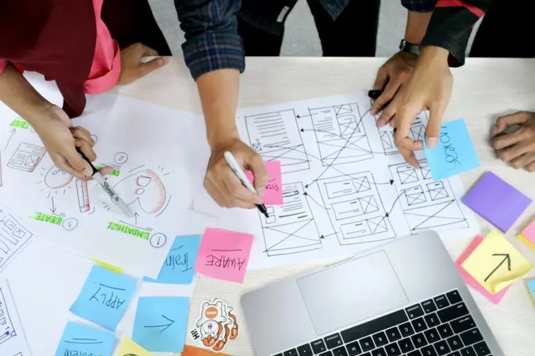 A group of designers working on a project assigned in UX bootcamp.
