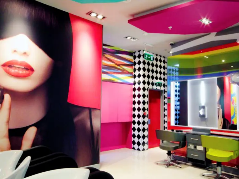 Maximalist salon design featuring bold colors and patterns, creating a vibrant and lively atmosphere.
