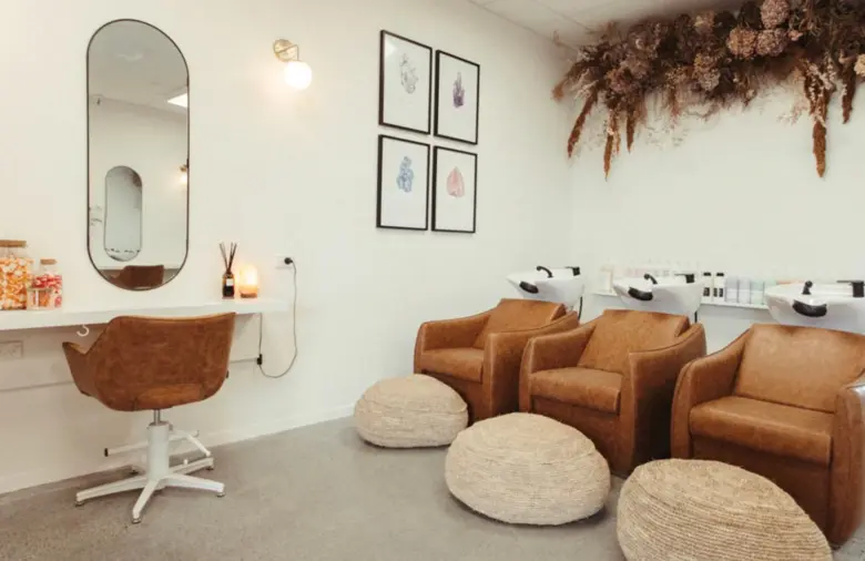 Salon interior with wood accents and minimalist design, creating an airy and functional space.