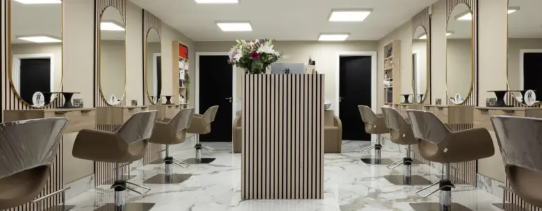 salon design featuring marble countertops, elegant decor, and a calming color palette.

