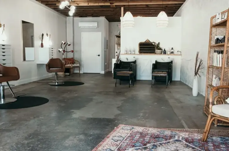 Statement rugs in a small salon.
