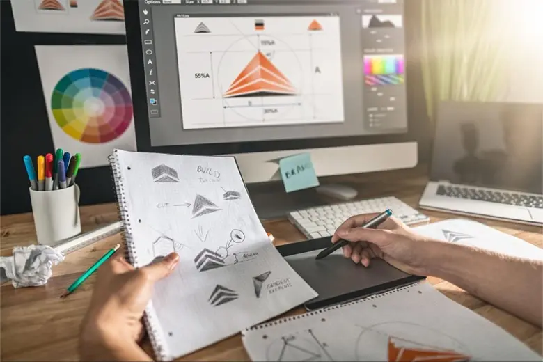 A graphic designer working on creating a logo. A graphic designer working on creating a logo.