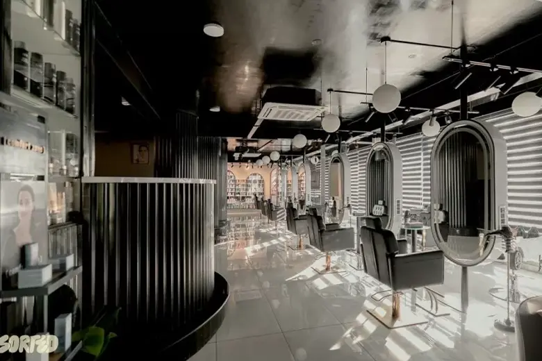 Salon featuring a sleek black-and-white monochromatic color palette. Salon featuring a sleek black-and-white monochromatic color palette.