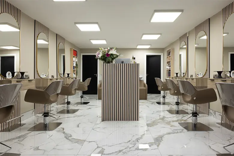 Image displaying marble countertops and marble flooring in salon interior design.
Image displaying marble countertops and marble flooring in salon interior design.