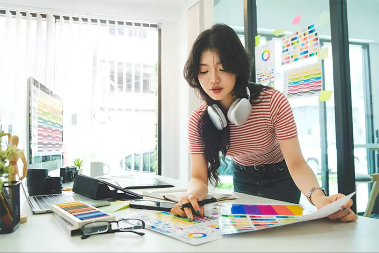 A graphic designer working on a design project.
