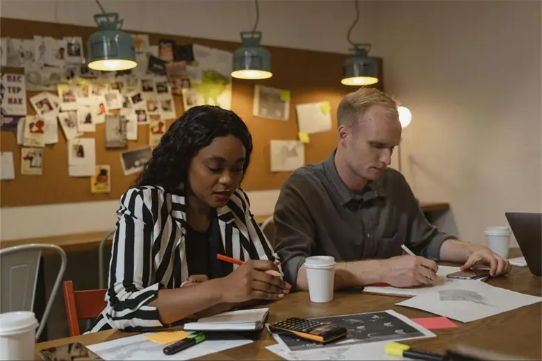 Employees working on techniques to foster creativity in design
