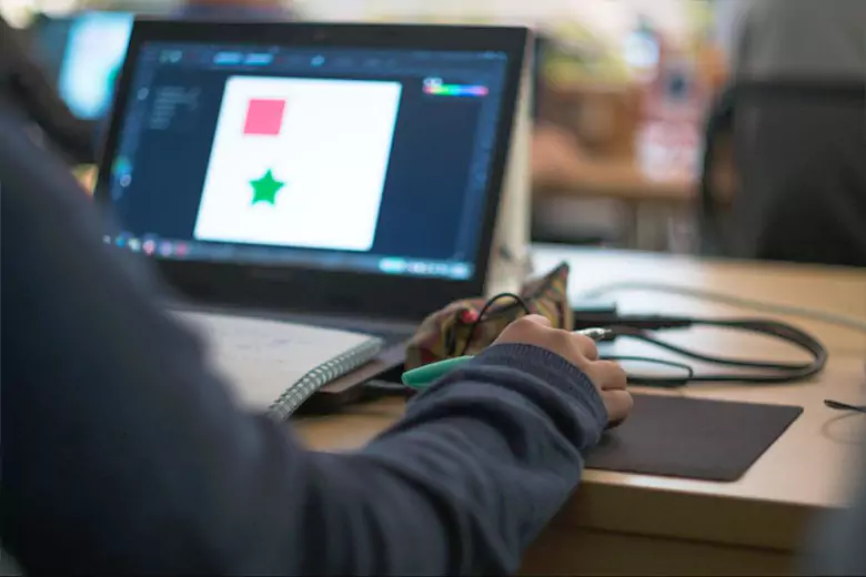 A graphic design student working on a project. A graphic design student working on a project.