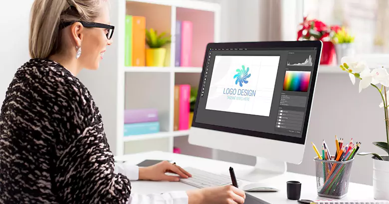 A graphic designer working on creating a logo design.