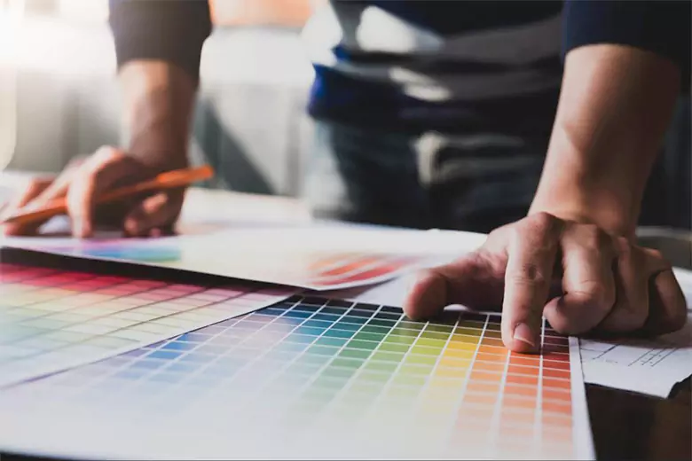 A designer working with a color palette.
